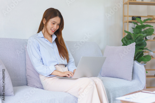 Home office concept, Businesswoman reading data on laptop to analysis marketing plan of startup