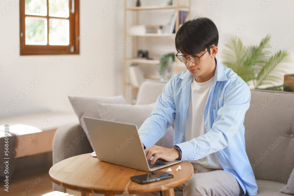 Business at home concept, Businessman typing on laptop about strategy and planning of new business Business at home concept, Businessman typing on laptop about strategy and planning of new business