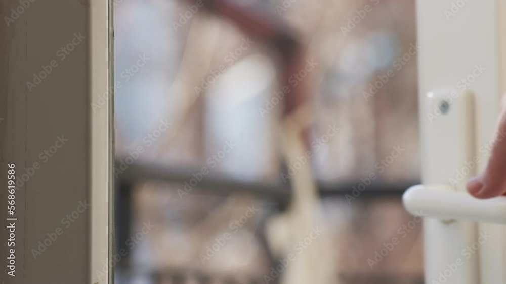 close up view of man open balcony door by handle. Sunny day, balcony door opens. close up view of man open balcony door by handle. Sunny day, balcony door opens.