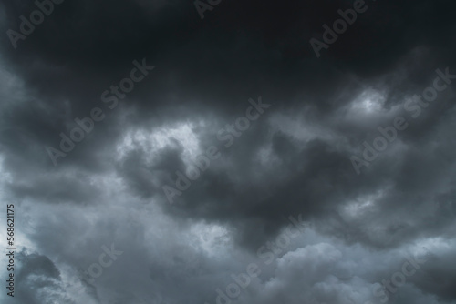 Dramatic dark storm thundercloud rain clouds on black sky background. Dark thunderstorm clouds rainny landscape. Meteorology danger windstorm disaster climate. Dark cloudscape storm disaster gray sky