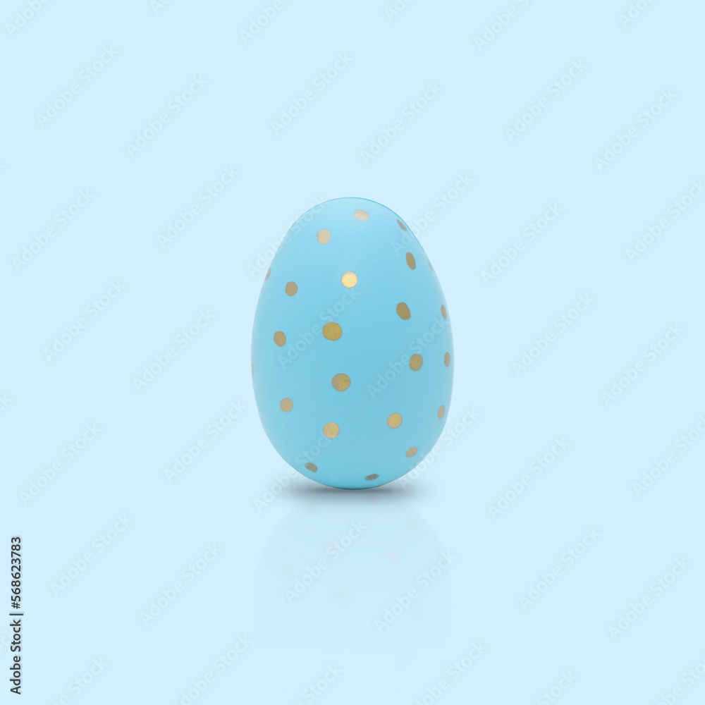 Happy Easter. Beautiful blue egg with different pattern on a blue background. Happy Easter. Beautiful blue egg with different pattern on a blue background.