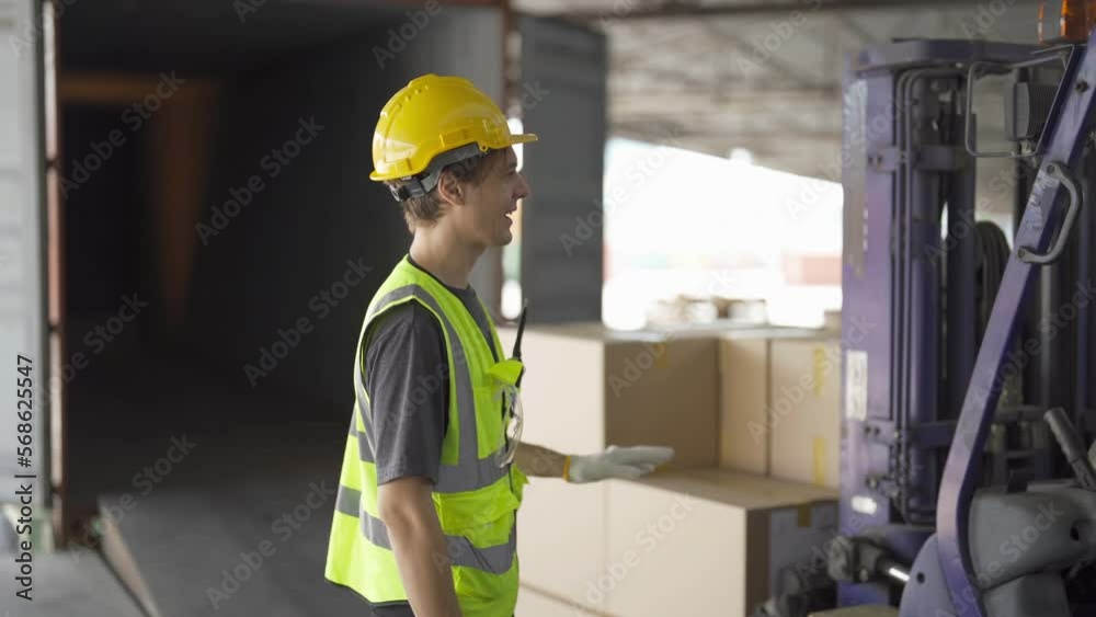 Teamwork of workers driving Fork lift truck with pallet car vehicle in warehouse retail store industry. Rack of stock storage.Cargo in ecommerce and logistic. Depot. People lifestyle. Shipment service Teamwork of workers driving Fork lift truck with pallet car vehicle in warehouse retail store industry. Rack of stock storage.Cargo in ecommerce and logistic. Depot. People lifestyle. Shipment service