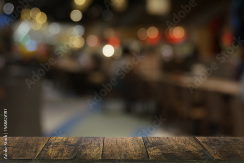 Wallpaper Mural Empty dark wooden table in front of abstract blurred boken bankground of restaurant. Can used for display or montage your products. Mock up for space. Torontodigital.ca