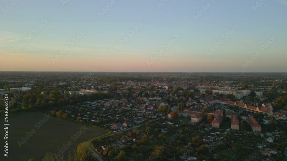 Unbelievable aerial view flight ascending drone
small town city Nauen brandenburg havelland Germany at summer 2022. High Quality 4k Cinematic footage