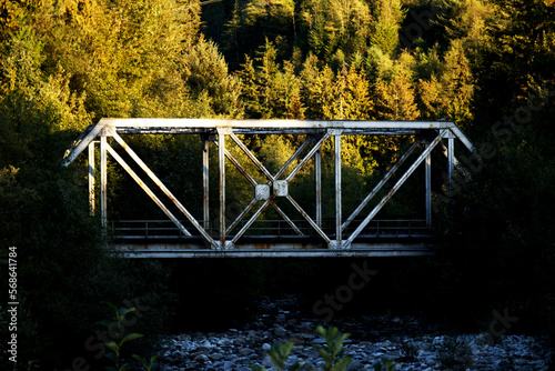 Old, metal railway bridge in the nature photo