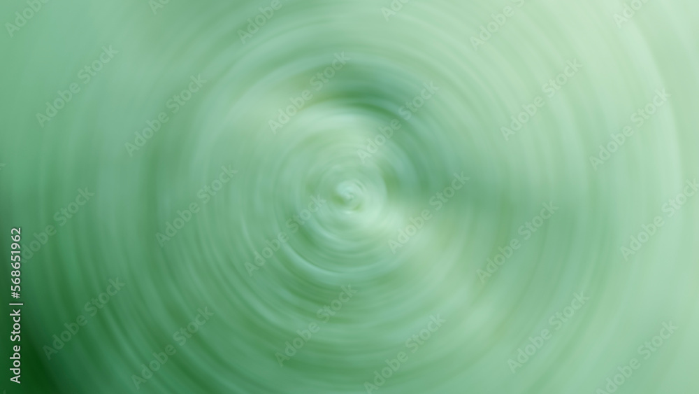 An image of a green carpet blurs swirling circles.