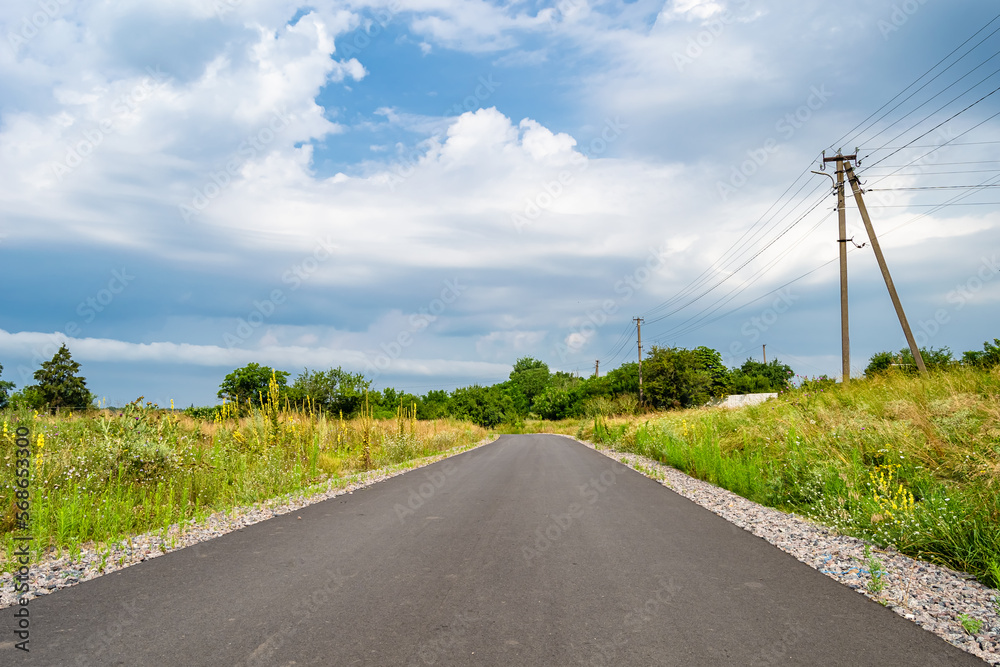 Beautiful empty asphalt road in countryside on colored background Beautiful empty asphalt road in countryside on colored background