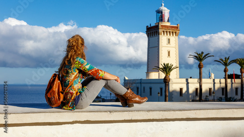 Woman tourist looking at lighthouse of Cap Spartel,  Tanger,  Morocco in Africa