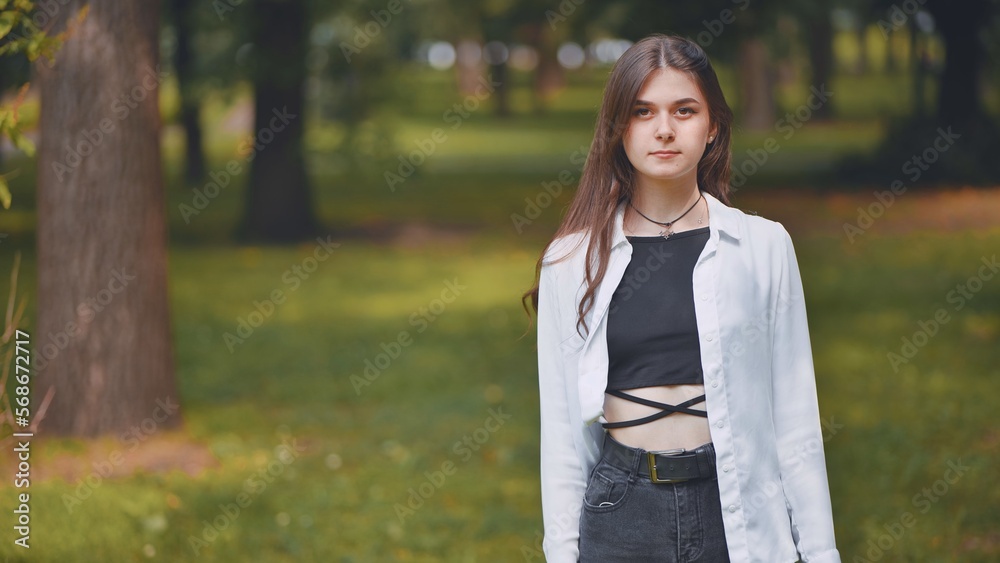 Portrait of a smiling young Georgian girl in a park.