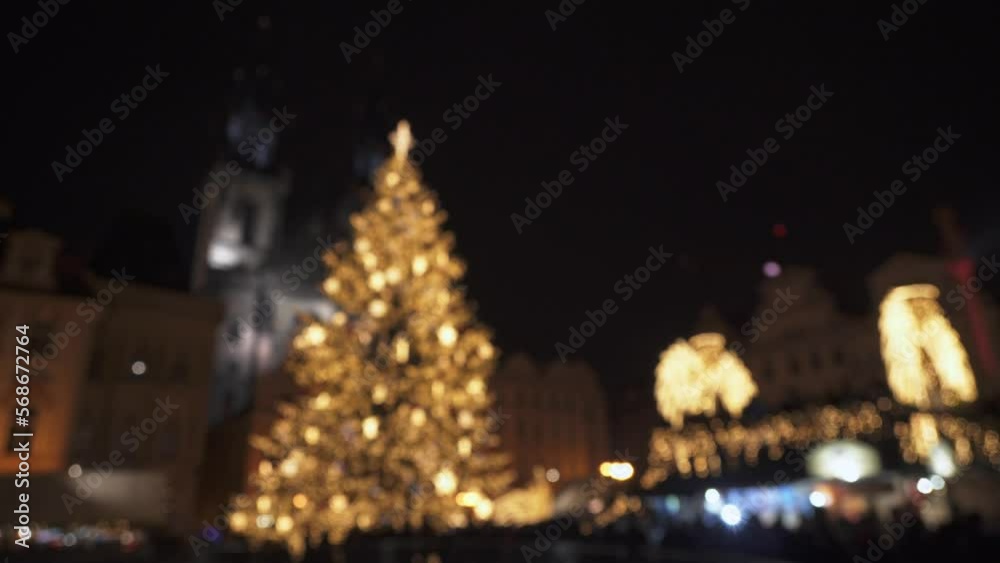 Christmas tree lights in town, crowds of people, soft focus view Christmas tree lights in town, crowds of people, soft focus view