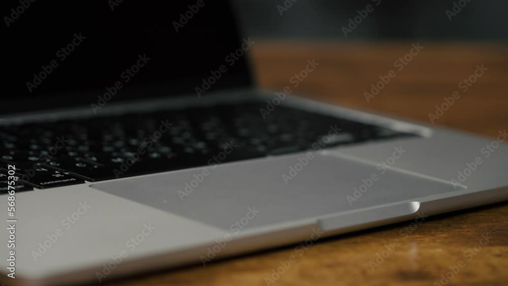 Minsk, Belarus - December 11th 2022: Slide Shot Touchpad Trending Macbook Air M2 Laptop. Laptop detail in office space. 4K video. Minsk, Belarus - December 11th 2022: Slide Shot Touchpad Trending Macbook Air M2 Laptop. Laptop detail in office space. 4K video.