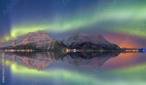 Northern lights or Aurora borealis in the sky over Tromso fjords - Tromso, Norway