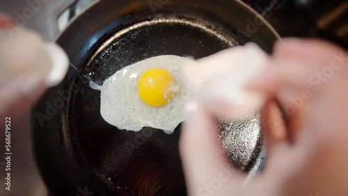 fried egg on a pig-iron . cooking fried eggs
