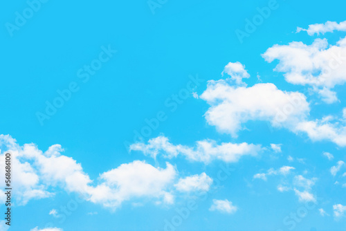 Heaven background. Cloudy sky background. Peaceful bright blue sky texture. Fluffy clouds on the sky background. Cloudscape view.