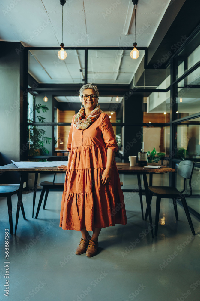Successful businesswoman smiling in an office Successful businesswoman smiling in an office