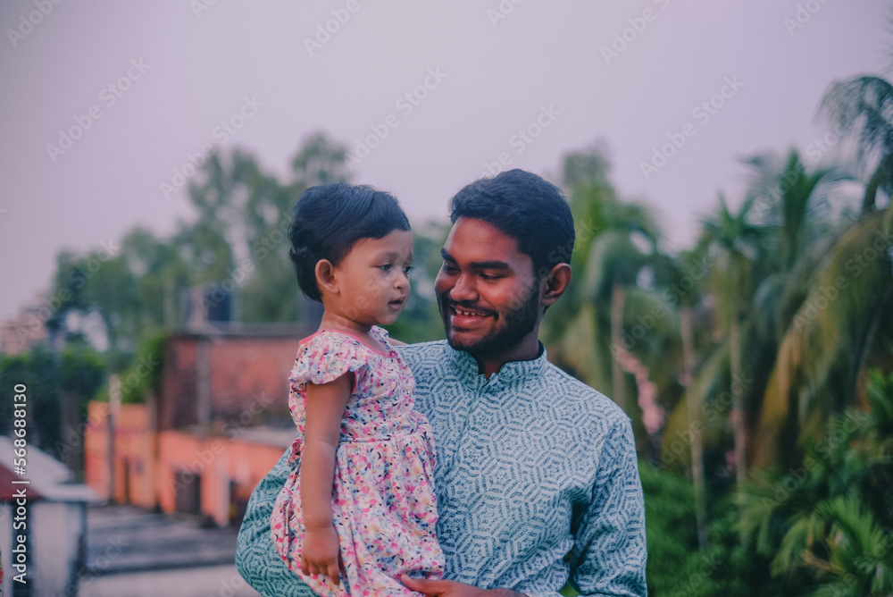 Εκτύπωση καμβά South asian uncle holding his niece in outdoor park