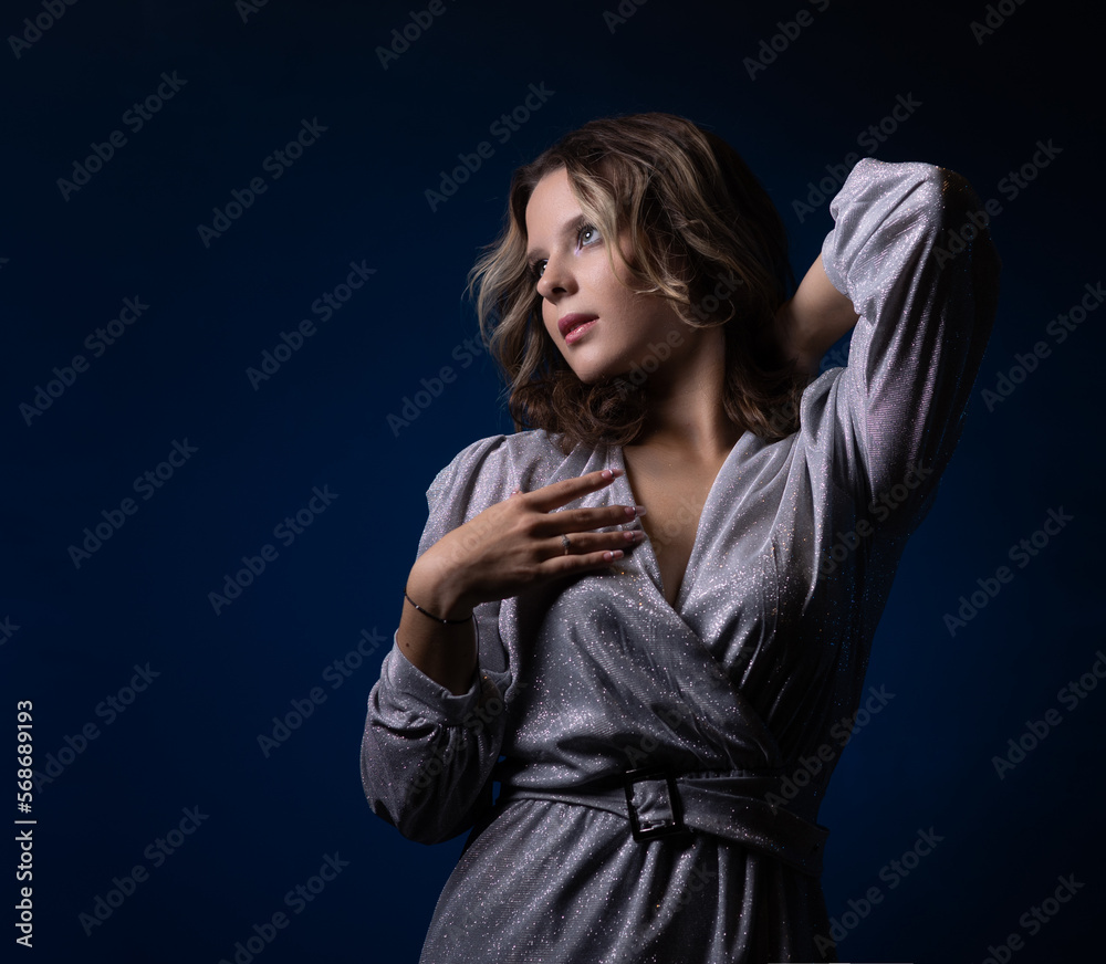 teenage girl in a silver dress