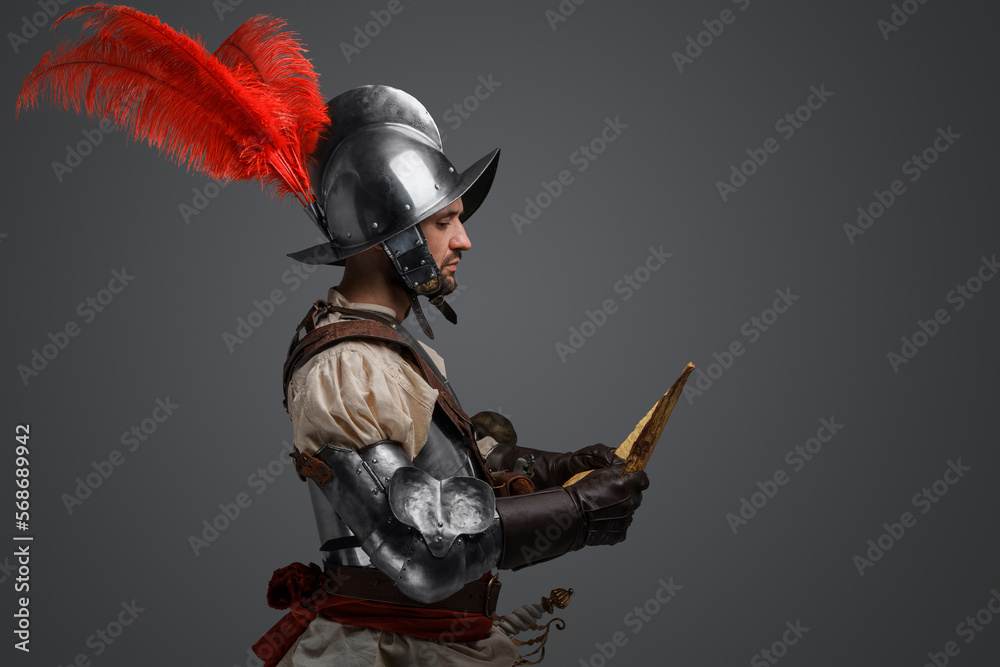 Wall Mural Studio shot of isolated on gray background conquistador with map.