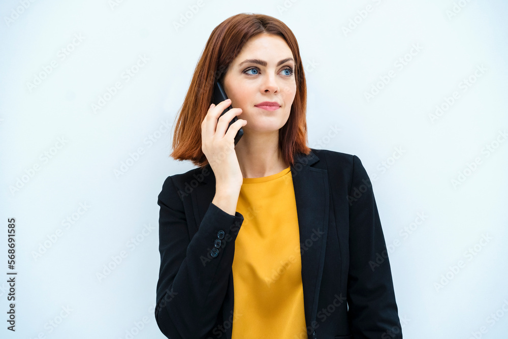 Businesswoman on the phone against white background Businesswoman on the phone against white background
