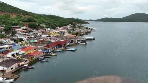 Camera moving over the waterfront of small Venezuelan town Mochima in Mochima National Park, Venezuela. photo