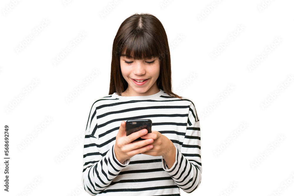 Little caucasian girl over isolated background sending a message with the mobile Little caucasian girl over isolated background sending a message with the mobile