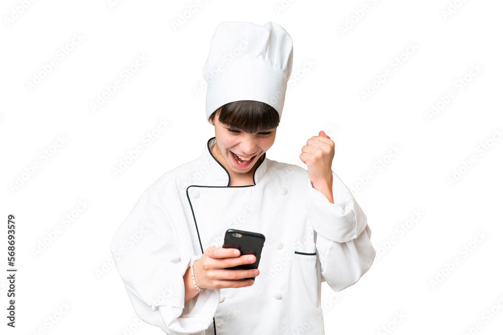 Little caucasian chef girl over isolated background surprised and sending a message