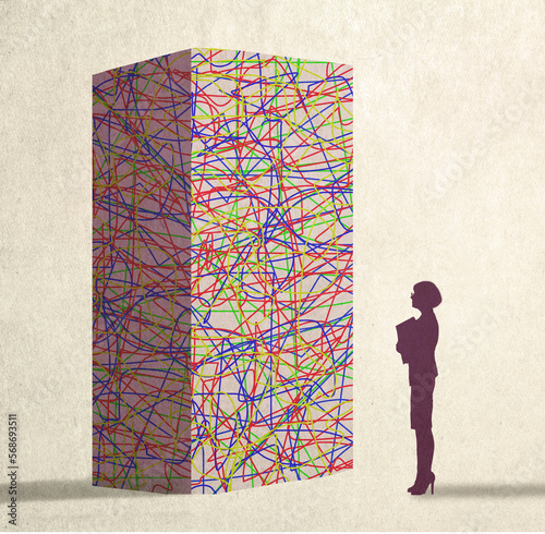 Illustration of businesswoman standing in front of tangled block representing complex challenge