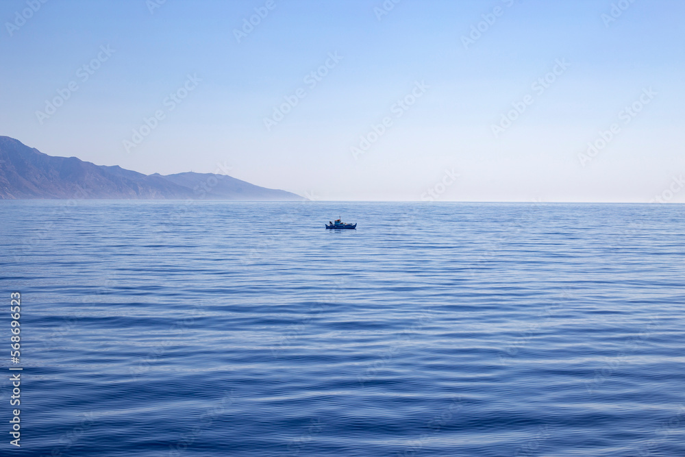 Spain,Balearic Islands, Lone boat inMediterranean Sea