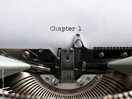 The word chapter 1 written with a vintage typewriter. Storytelling, book writing or authorship concept.