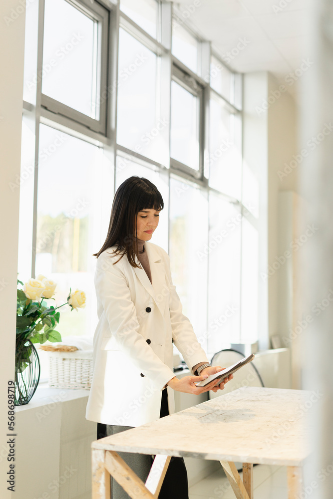 Woman choosing from samples for interior furnishing