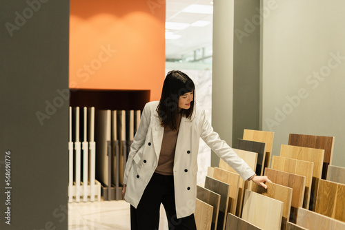 Woman choosing from samples for interior furnishing photo