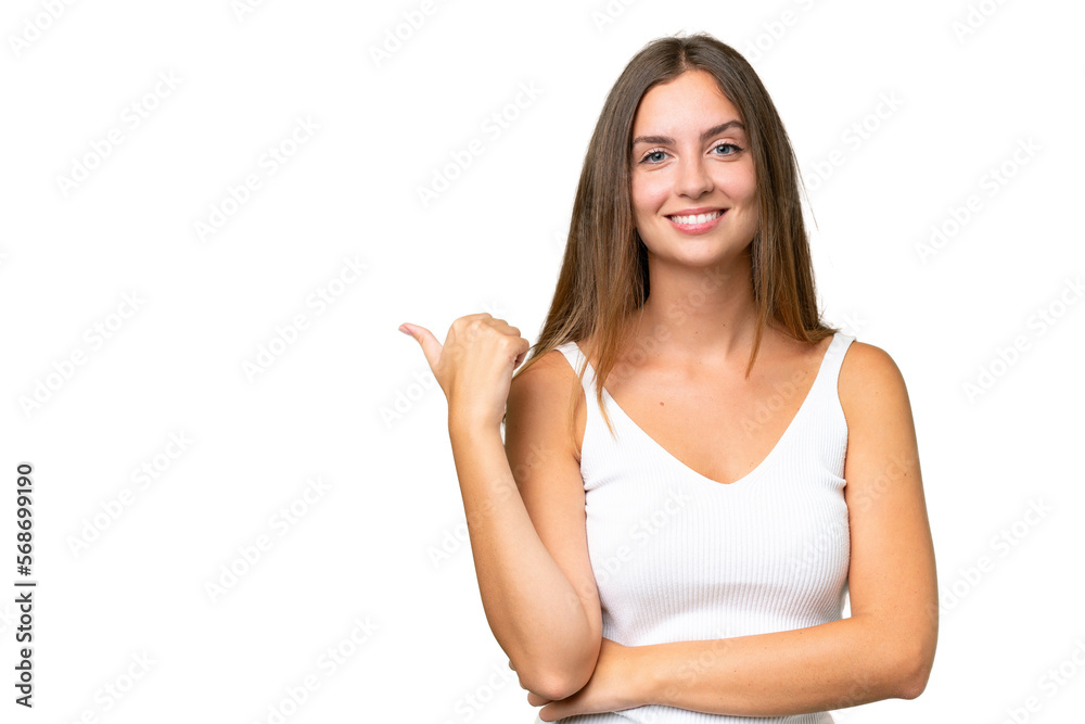 Young pretty woman over isolated background pointing to the side to present a product Young pretty woman over isolated background pointing to the side to present a product