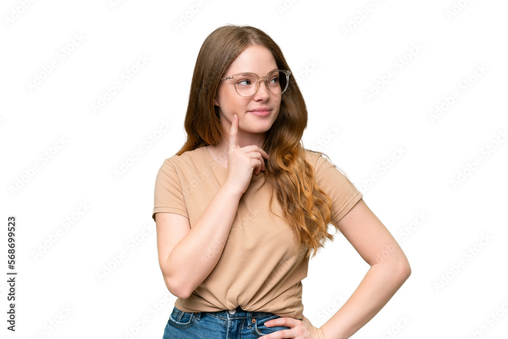 Young pretty woman over isolated background thinking an idea while looking up Young pretty woman over isolated background thinking an idea while looking up