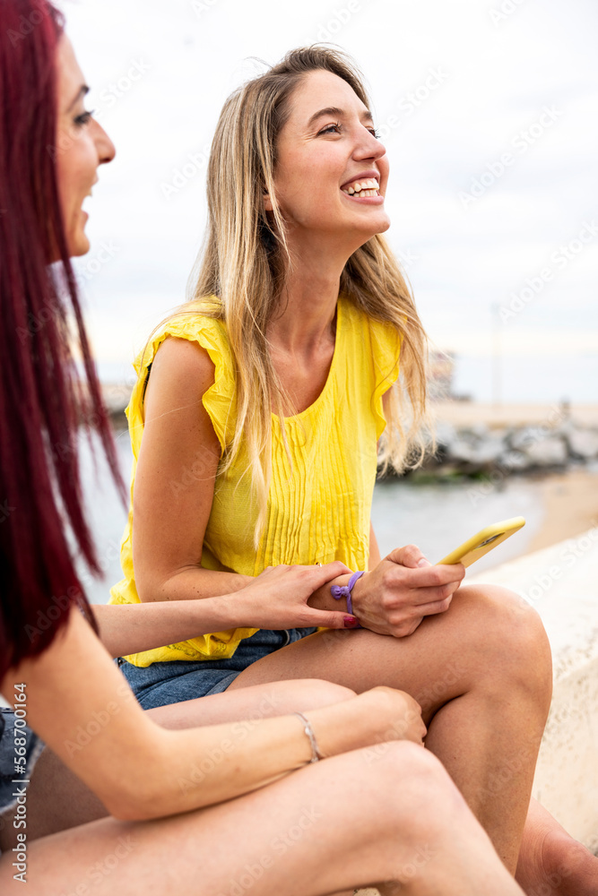 Happy woman having fun with friend at promenade Happy woman having fun with friend at promenade