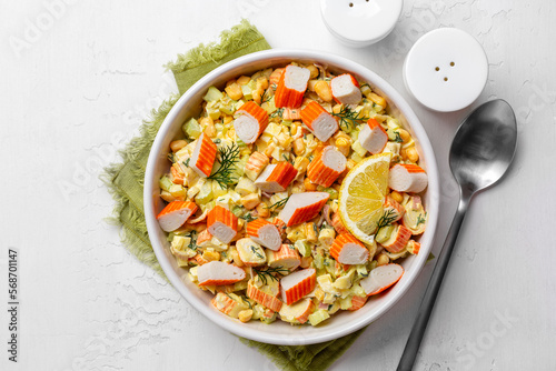 Creamy Crab Salad. Combines imitation crab meat with a mixture of celery, mayonnaise, corn, hard boiled eggs, diced onion, lemon. Top view.