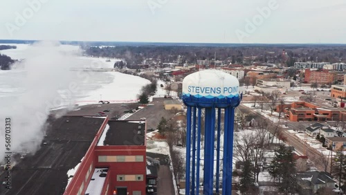 Aerial, water tower in Stevens Point Wisconsin during winter day photo