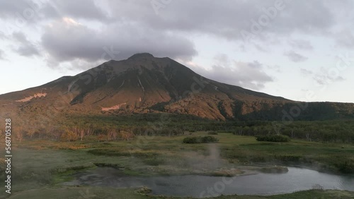 The volcano. The reflected in the thermal spring . Kamchatka Peninsula. Pacific Ocean. Russia.