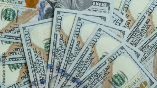 One hundred 100 dollars banknotes bills appearing, fanning out, disappearing on white background. Paper banknotes, cash, currency savings, finance bank, payment, salary, money, business. Flat lay.