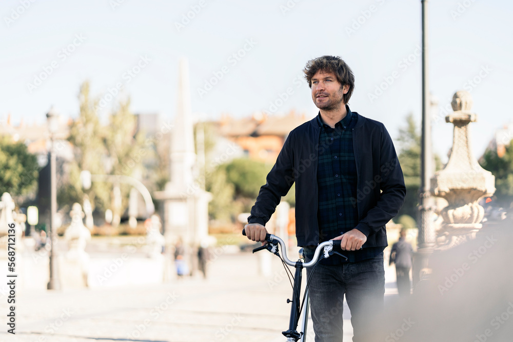 Young Man Using Bike Portrait