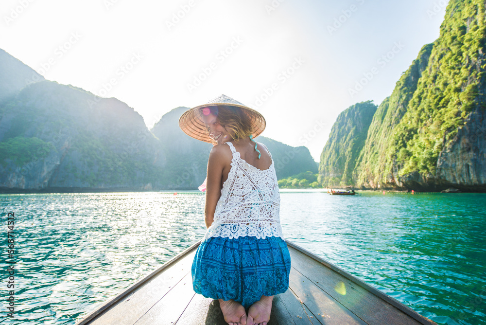 Beautiful woman on a long-tail boat in Thailand - Tourist visiting tropical island on south-east Asia, concepts about lifestyle and travel
