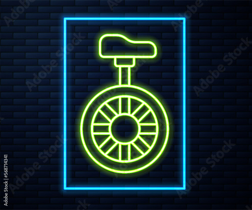 Glowing neon line Unicycle or one wheel bicycle icon isolated on brick wall background. Monowheel bicycle. Vector