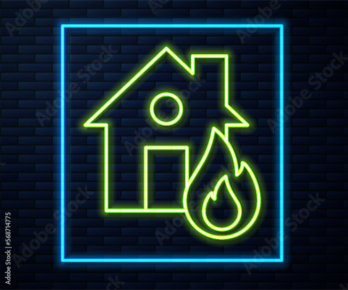 Glowing neon line Fire in burning house icon isolated on brick wall background. Vector