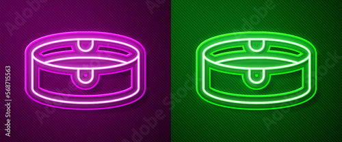 Glowing neon line Ashtray icon isolated on purple and green background. Vector