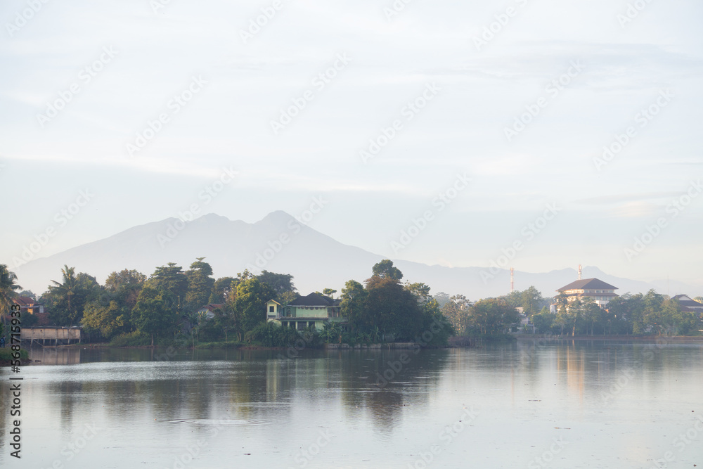 a beautiful landscape in the morning with mountain and lake