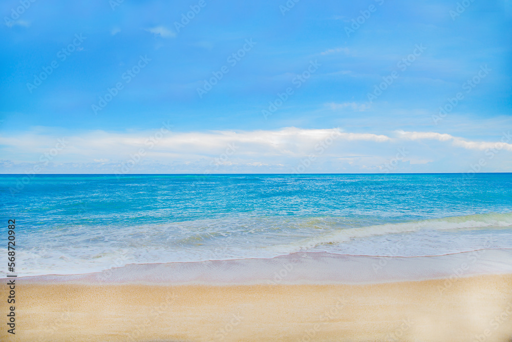 Beach with blue sea water and blue sky