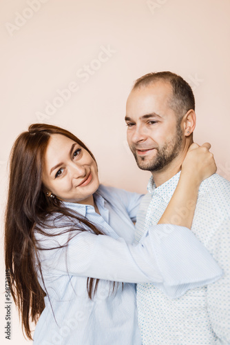 man and a woman in love pose for a family portrait © Cavan
