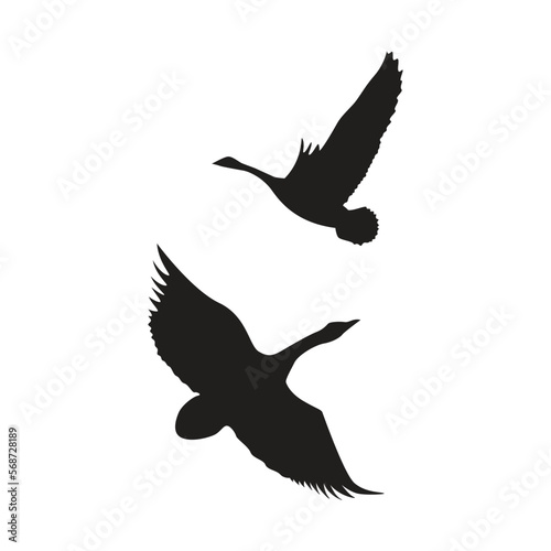 flying swan icon. Silhouette of a group of flying geese.