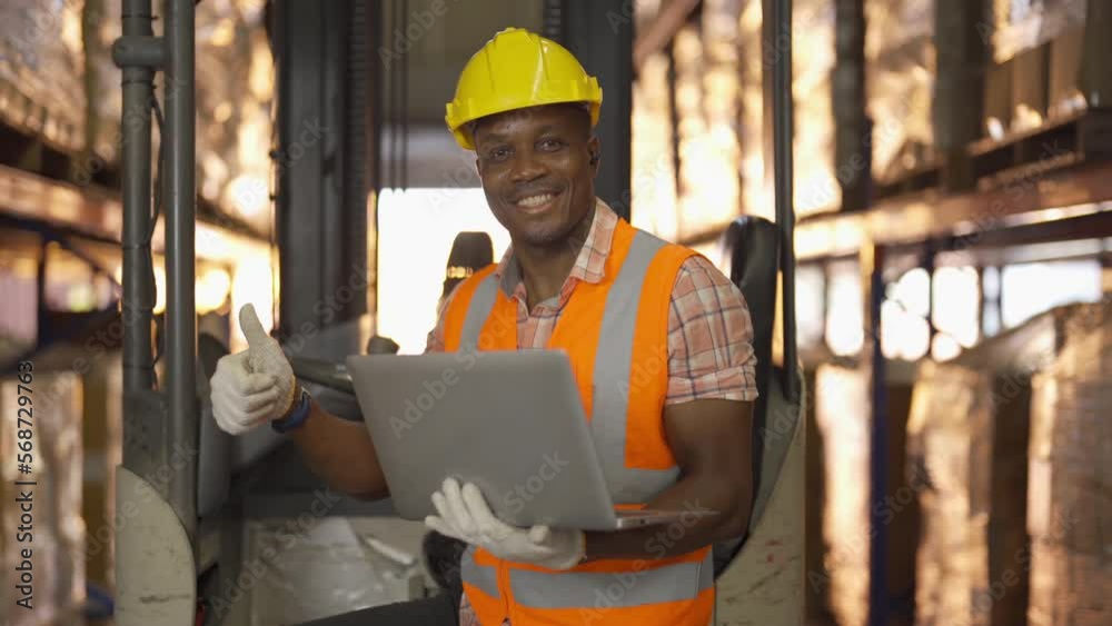 Portrait of black man worker working in large warehouse retail store industry factory. Rack of stock storage. Cargo in ecommerce and logistic concept. Depot. People lifestyle. Shipment service. Portrait of black man worker working in large warehouse retail store industry factory. Rack of stock storage. Cargo in ecommerce and logistic concept. Depot. People lifestyle. Shipment service.