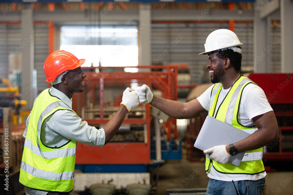 Male worker african american teamwork engineer successful handshake at industrial. contract conection partnership engineering success. Male worker african american teamwork engineer successful handshake at industrial. contract conection partnership engineering success.
