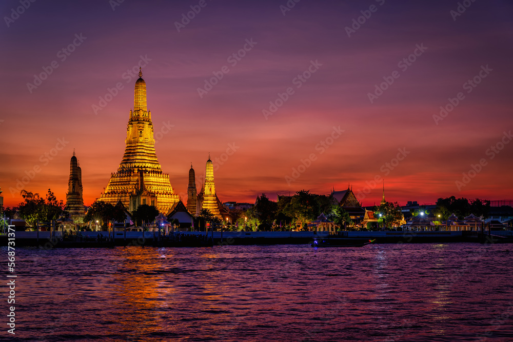 The Buddhist Temple Wat Arun during dusk, one of the most popular and beautiful tourist attractions of Bangkok, Thailand